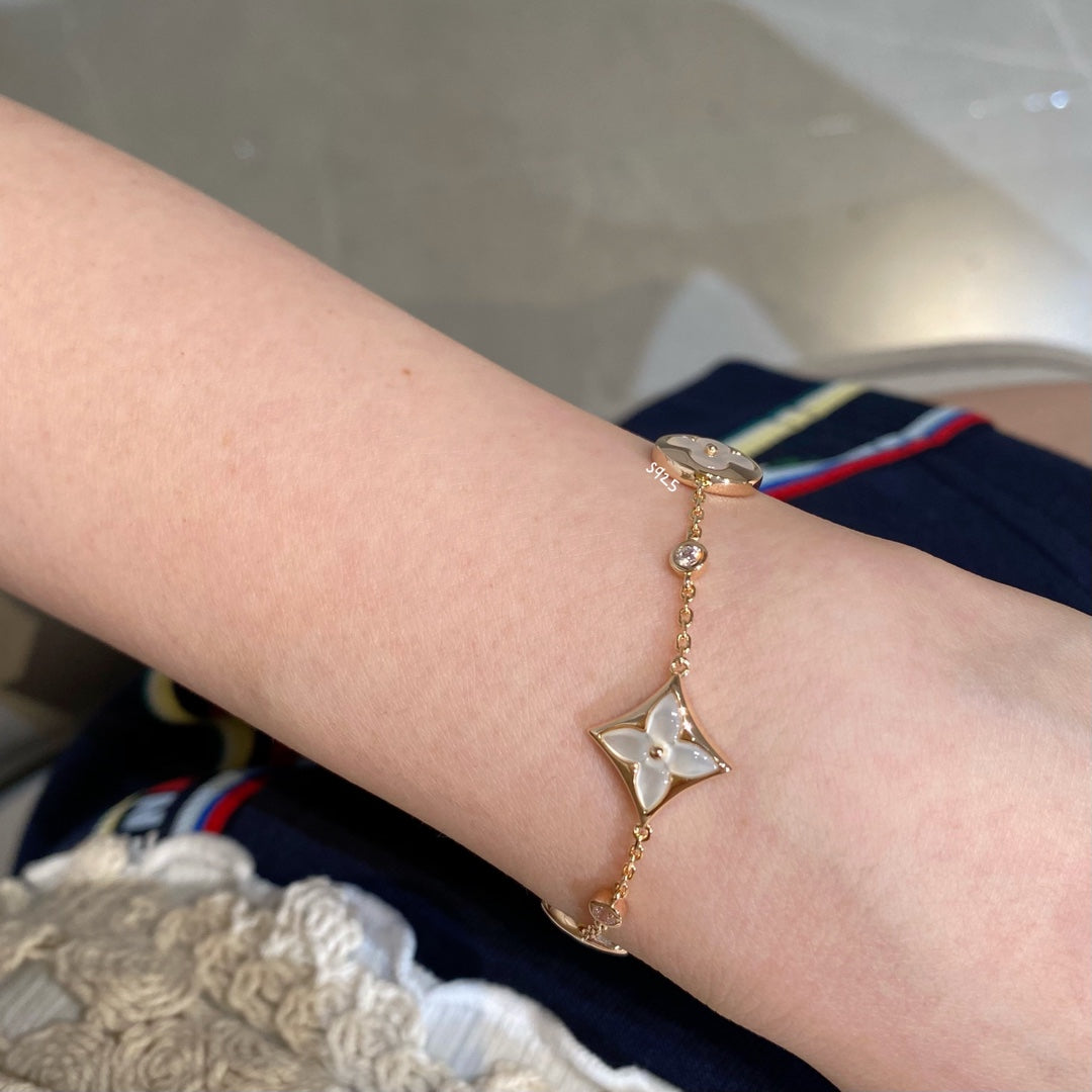 ¡®Twinkle jewelry¡¯STAR AND SUN 4 MOTIF WHITE MOP PINK GOLD BRACELET